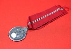 Ostmedaille am Band